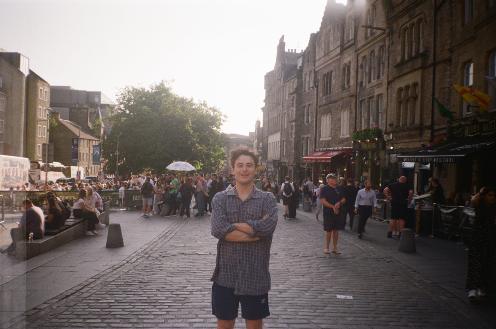 alex standing on a cobbled street in edinburgh